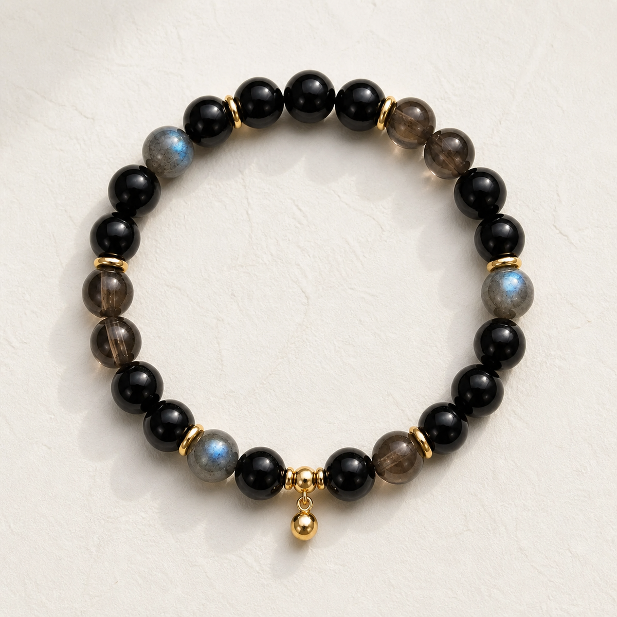 Onyx Meridian Bracelet on warm ivory background