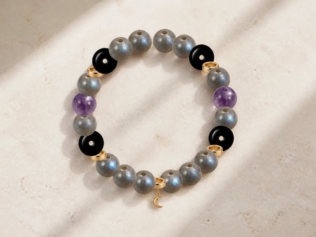 Finished AUVRESSA gemstone bracelet on a warm ivory surface